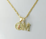 Gold-plated chain necklace with two Virgin Mary pendants and a letter M charm.