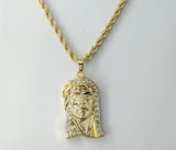 Gold plated braided chain Jesus pendant necklace with rope chain detail.