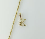 A delicate gold plated rope and braided chain necklace with a small letter pendant. 
A gold plated braided rope chain ne