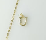 A delicate plated star chain necklace with a small letter U pendant.