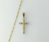 A delicate gold plated cross pendant on a small star chain necklace.