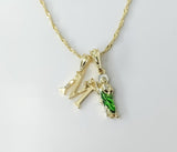 Gold plated multicolor Saint Jude pendants on a 14K twist chain necklace.