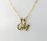 Gold plated Virgin Mary double pendants on 3mm mariner chain necklace.
Tri-color letter M and flat anchor pendant on del