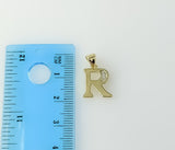 Gold-plated pendant featuring a delicate 3mm star-shaped silver letter R design.
Gold-plated pendant with intricate deta
