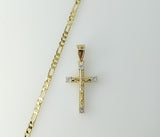 Gold plated Figaro chain necklace with small cross pendant and delicate design.